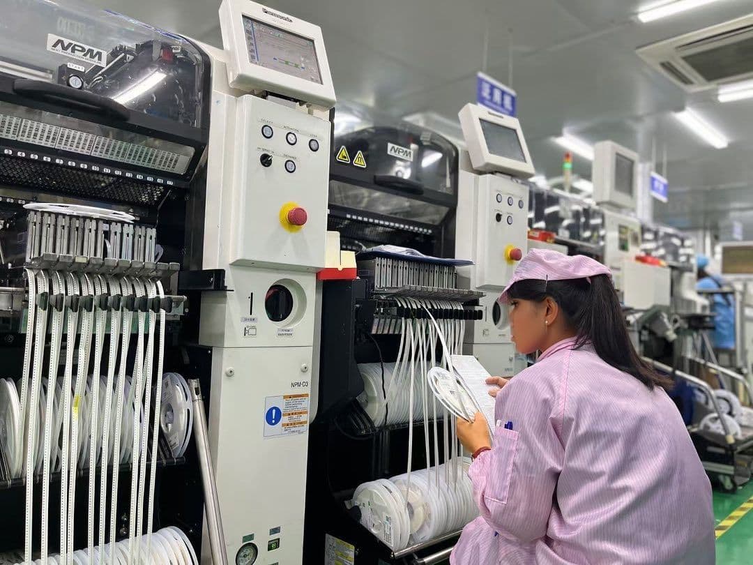 Quality inspector checking SMD components